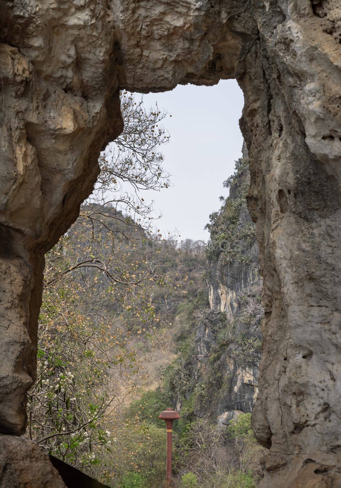 Beautiful scenery view of The Phanthurat's Mirror a small natural arch at Khao Nang Phanthurat Forest Park. Natural background, Space for text, Selective focus.