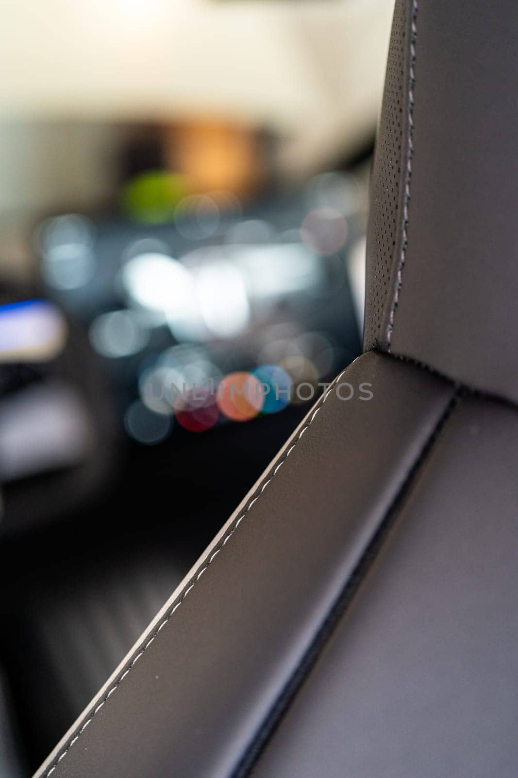 Denver, Colorado, USA-May 5, 2024-This image captures a detailed close-up view of the intricate stitching on a leather seat inside a Tesla Cybertruck, showcasing the high-quality materials and craftsmanship.