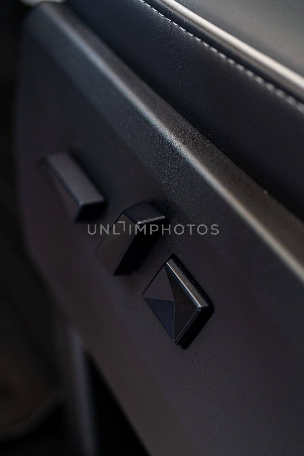 Denver, Colorado, USA-May 5, 2024-This image captures a close-up view of the seat adjustment buttons located in the Tesla Cybertruck, emphasizing the minimalist and sleek design of the vehicle interior controls.