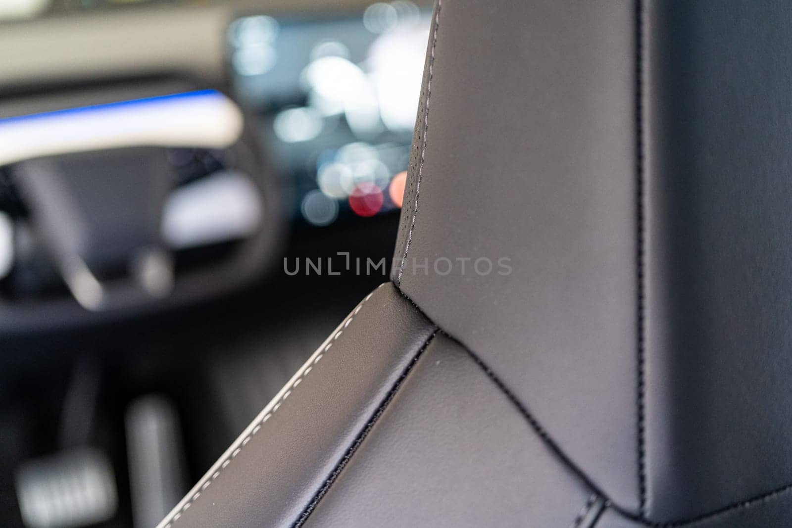 Denver, Colorado, USA-May 5, 2024-This image captures a detailed close-up view of the intricate stitching on a leather seat inside a Tesla Cybertruck, showcasing the high-quality materials and craftsmanship.