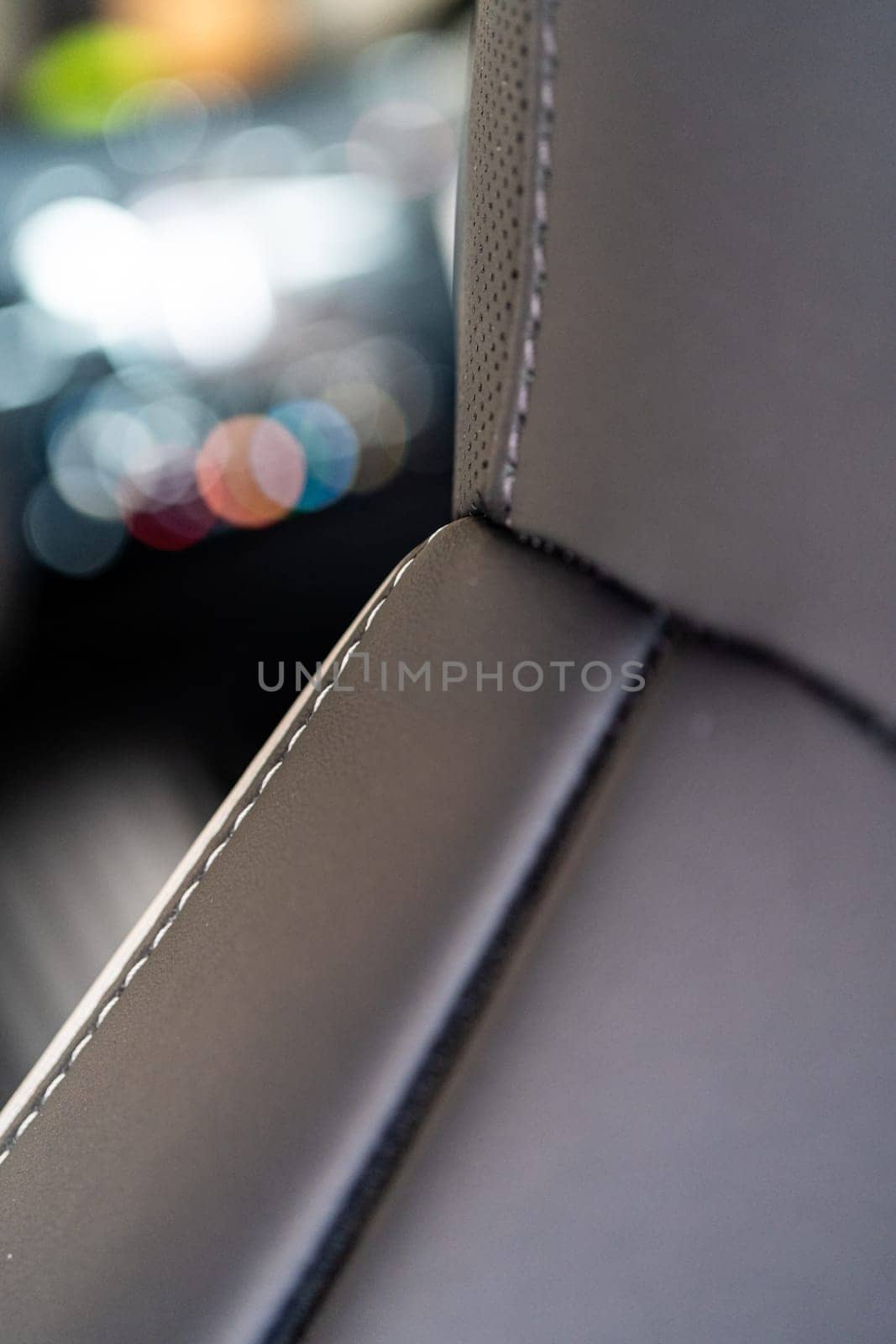 Denver, Colorado, USA-May 5, 2024-This image captures a detailed close-up view of the intricate stitching on a leather seat inside a Tesla Cybertruck, showcasing the high-quality materials and craftsmanship.