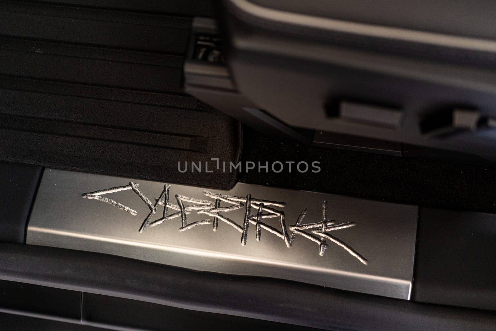 Close-Up of Tesla Cybertruck Signature Metal Engraving by arinahabich
