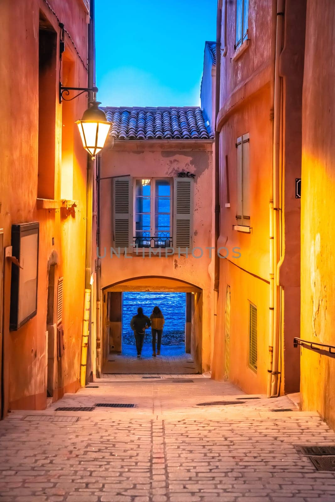 Saint Tropez stone alley with evening view, luxuty travel destination in southern France