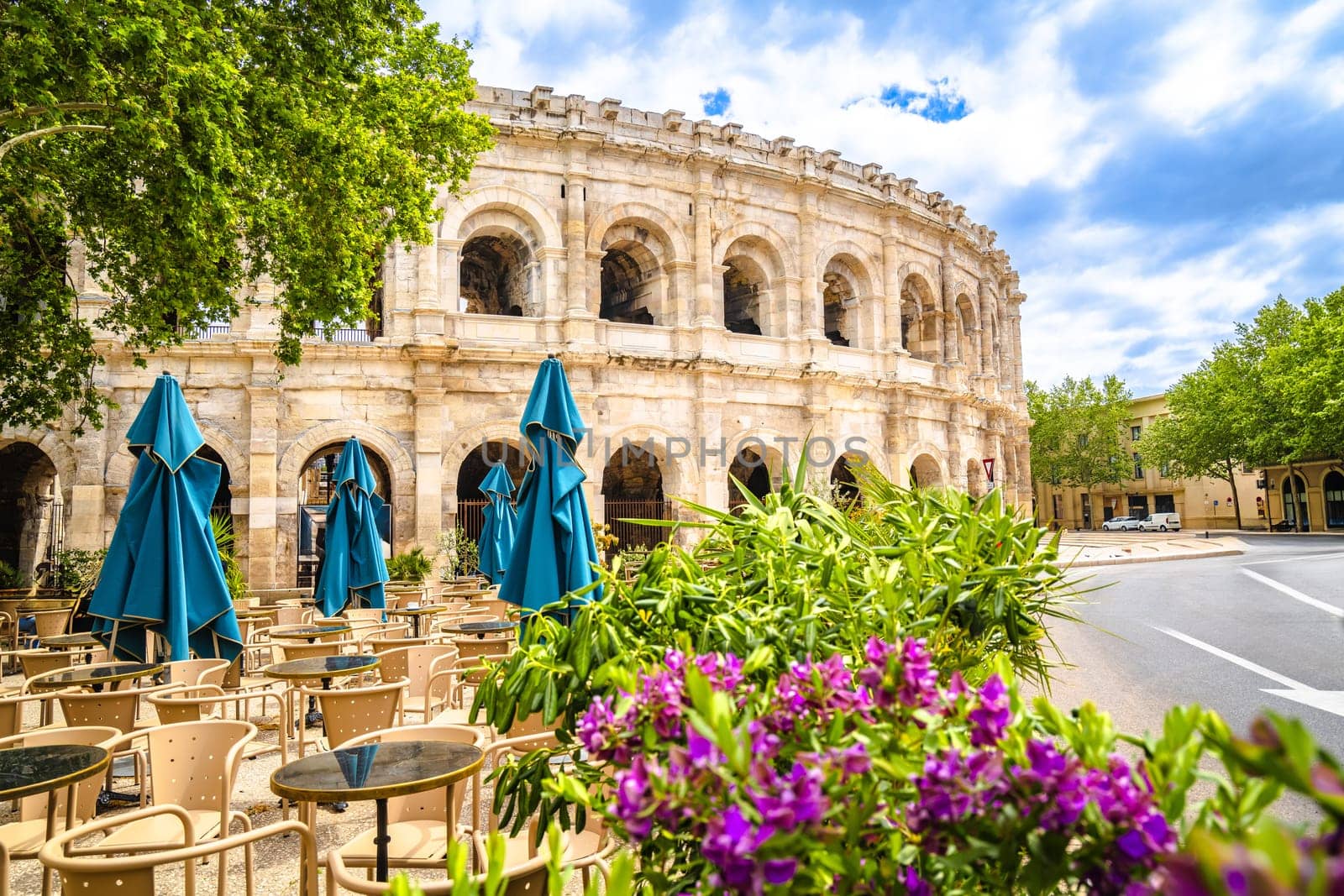 Nimes Amphitheatre historic landmark colorful street view, South of France