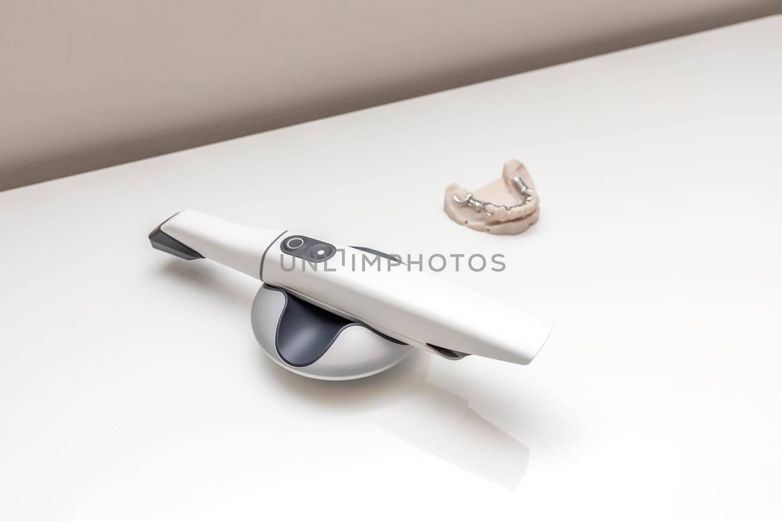 3D Intraoral Teeth Scanner For Imaging Tooth and Metal Frame Lower Partial Denture, Cobalt Chrome Dental Plate, Bridge Printed By 3d Printer on Table. Dental Equipment, Device, Dentistry. Horizontal