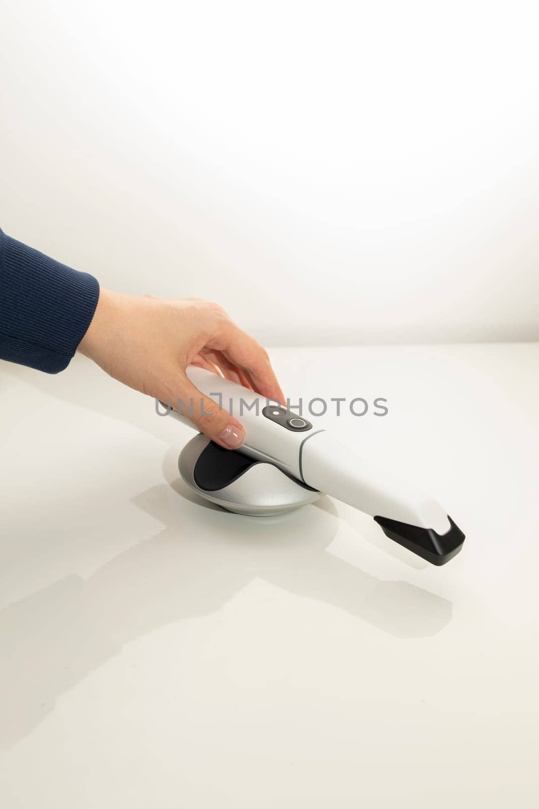 Doctor's Hand Holds 3D Intraoral Teeth Scanner For Imaging Tooth. Vertical Plane. Lab, Dental Equipment, Device, Dentistry. Copy Space. High quality photo