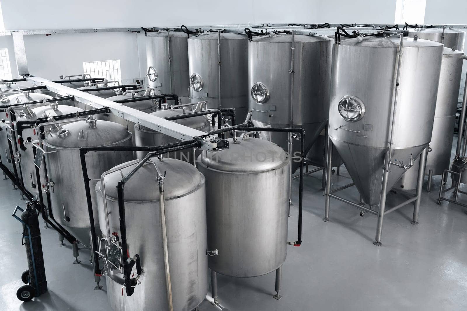 interior of a modern factory brewery with tanks inside