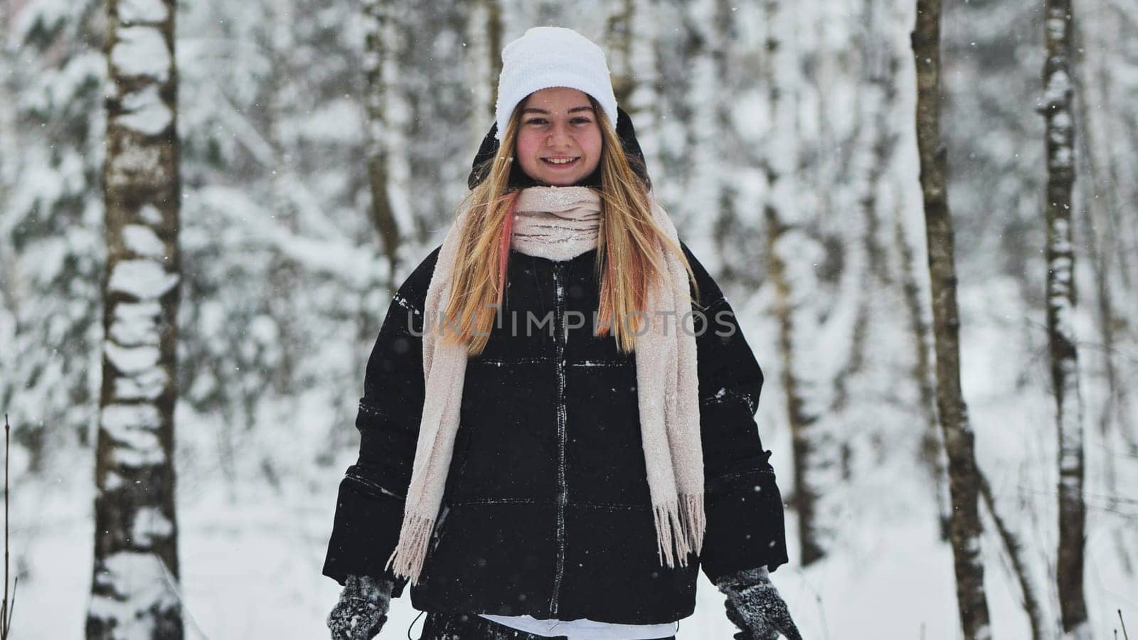 Portrait of a girl in winter in a birch forest