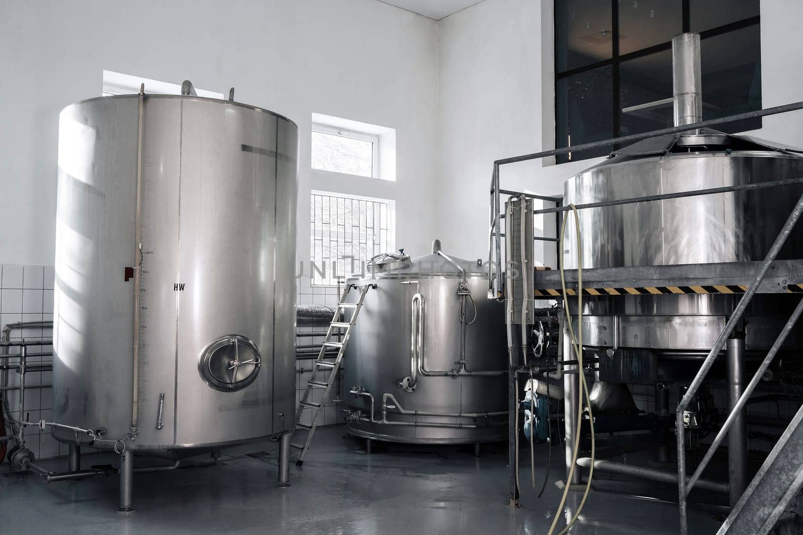 interior of a modern factory brewery with tanks inside