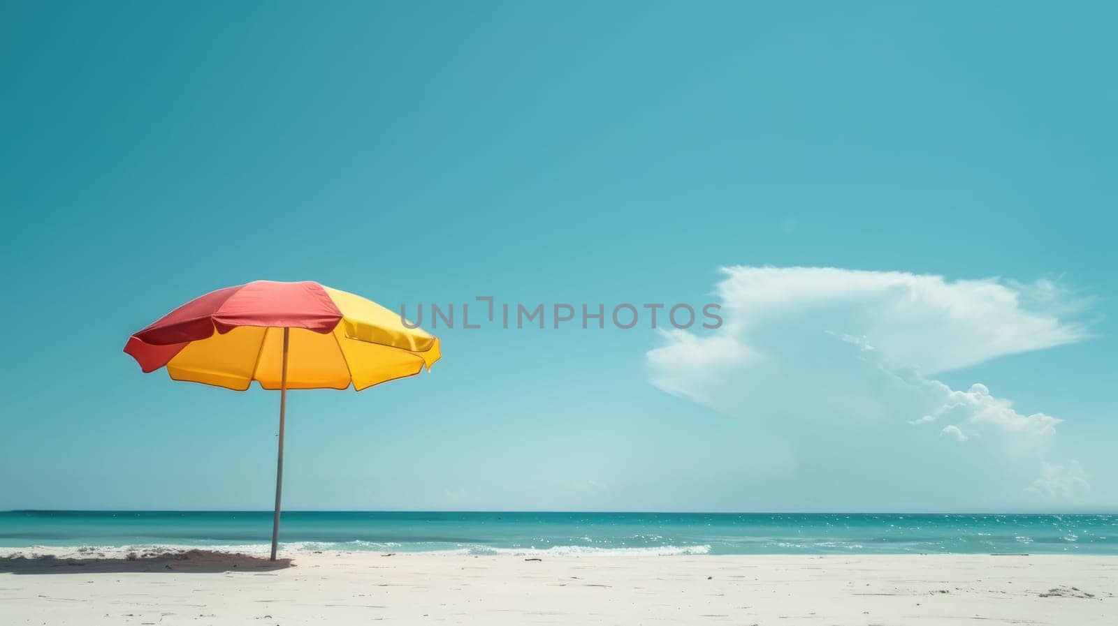A vibrant beach umbrella provides shade on the sandy shore overlooking the sparkling ocean, with people enjoying the coastal natural landscape under a clear sky AIG50