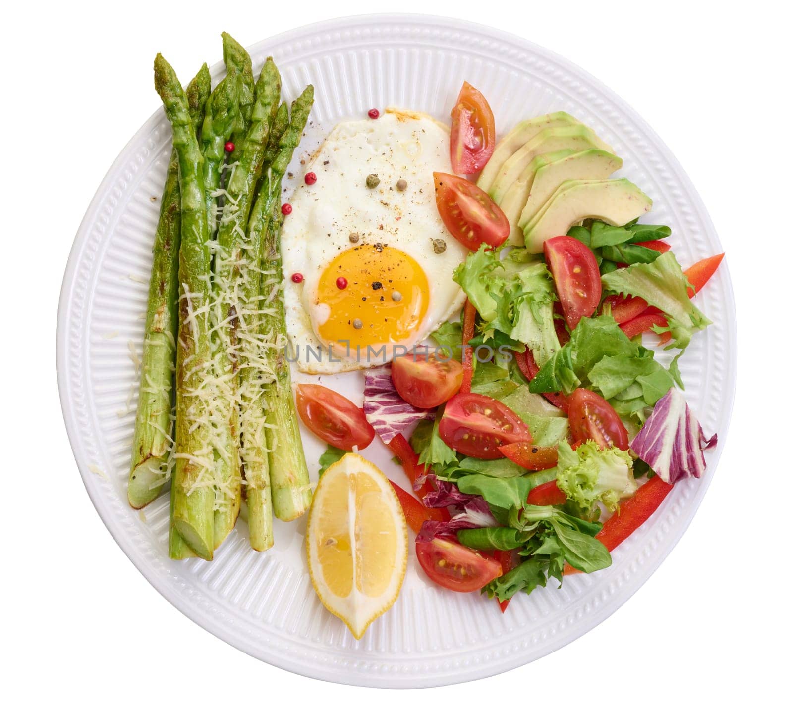 Round plate with cooked asparagus, fried egg, avocado and fresh vegetable salad by ndanko