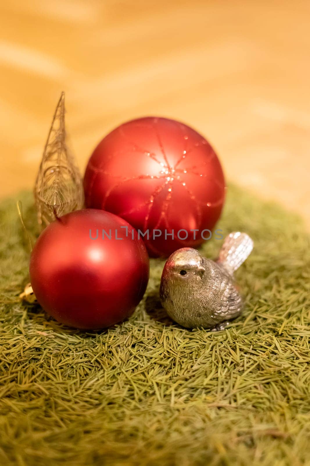 Festive decorations, balls, a tree, and a bird.