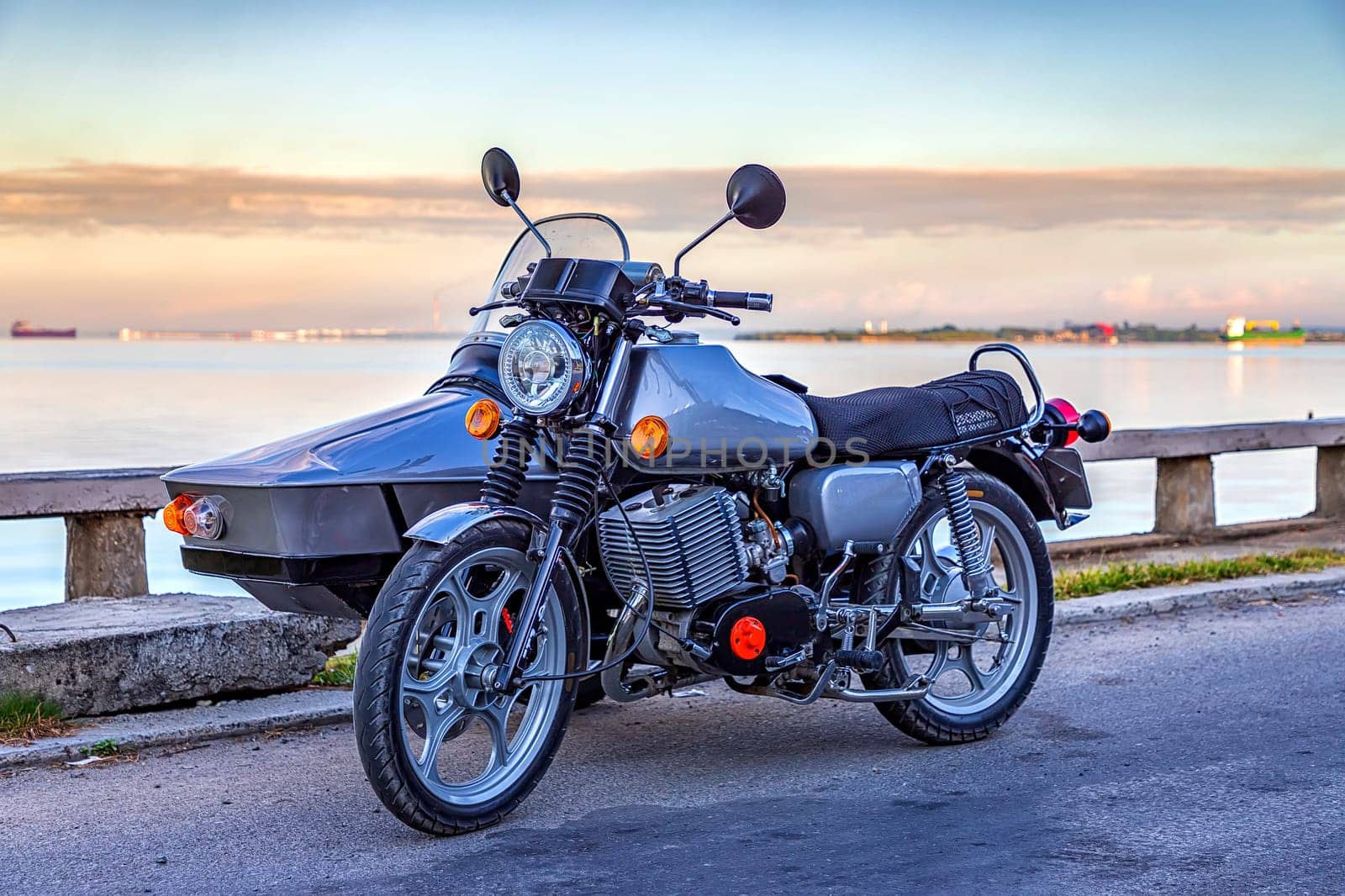 Recovered motorcycle with Sidecar parked near the sea. by EdVal
