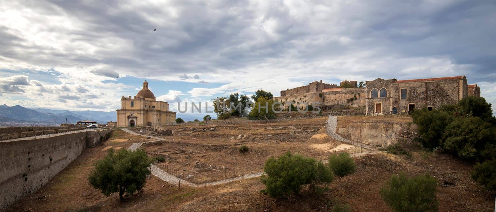 Panoramic view of the yard with cathedral and a Benedictine convent inside at Castle of Milazzo, Sicily. 
