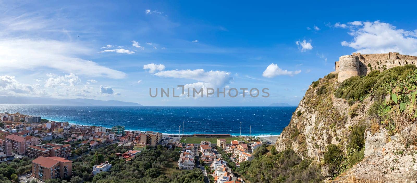 Panoramic view of the coast of Cefalu and fortress in la Roca in Sicily, Italy