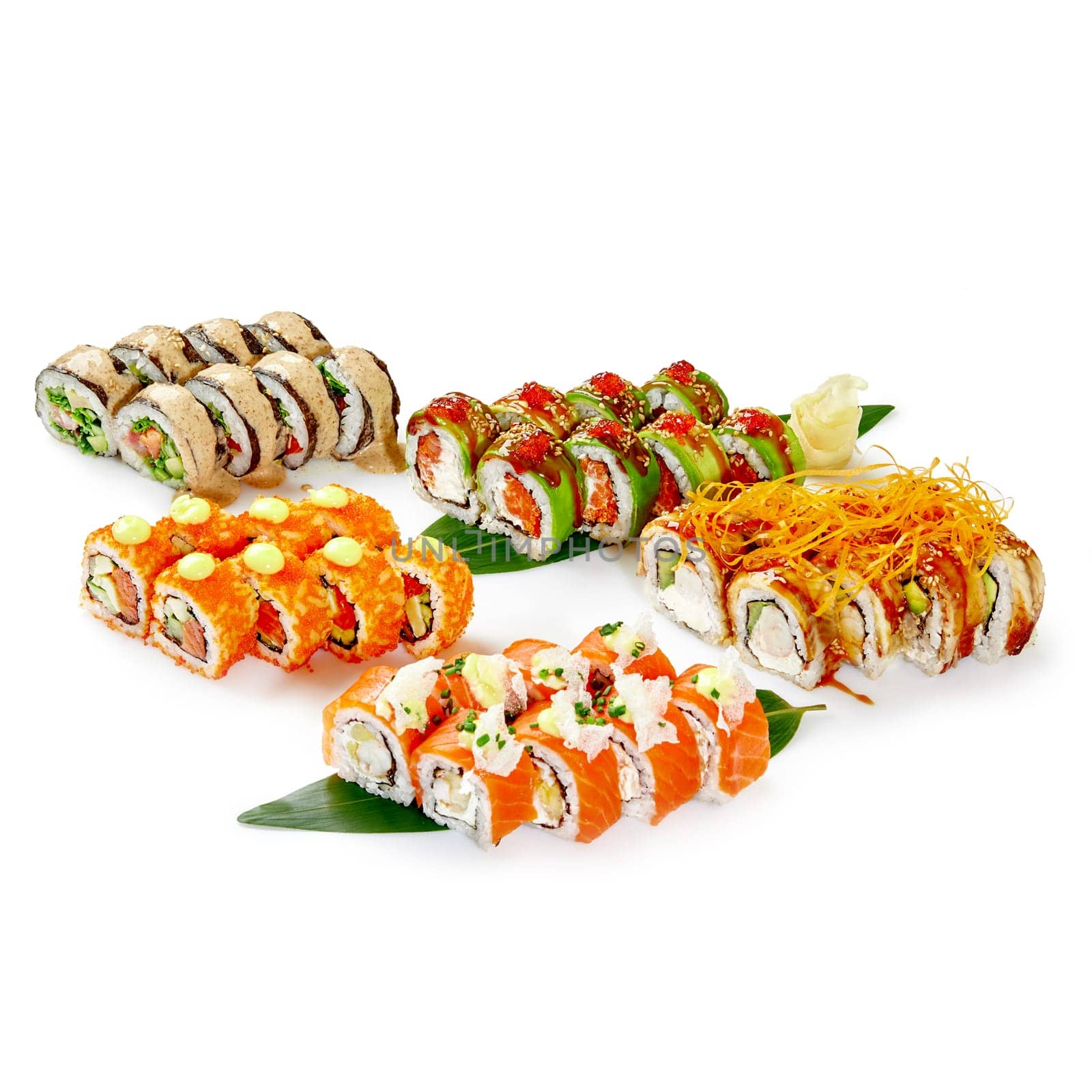 Diverse collection of specialty sushi rolls on bamboo leaves by nazarovsergey