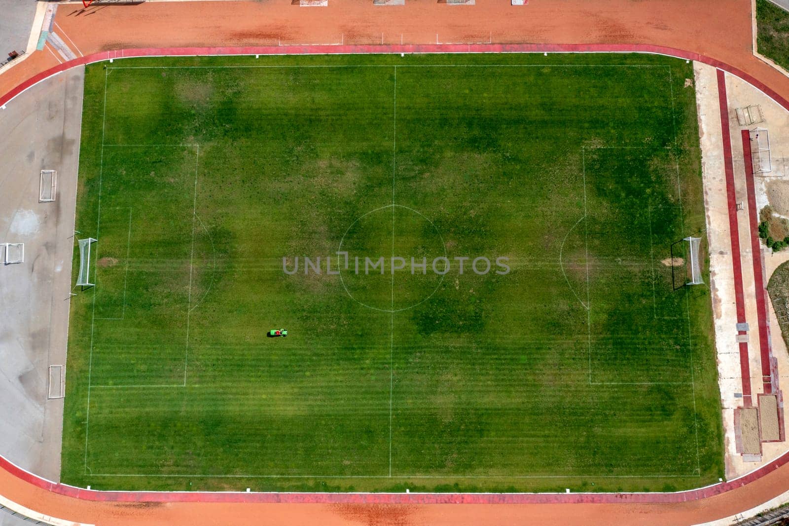 Aerial top view of soccer football sports recreation field ground, city stadium by EdVal
