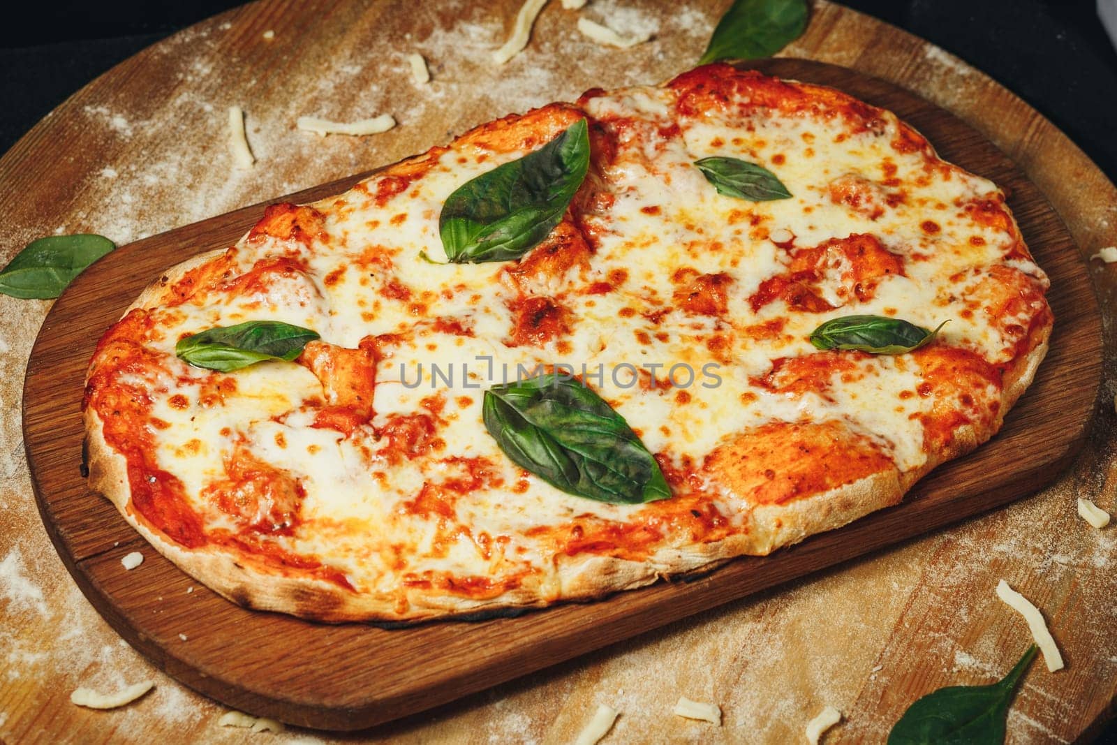 Handcrafted Heart-Shaped Margherita Pizza on Wooden Board, Garnished With Fresh Basil Leaves by Miron