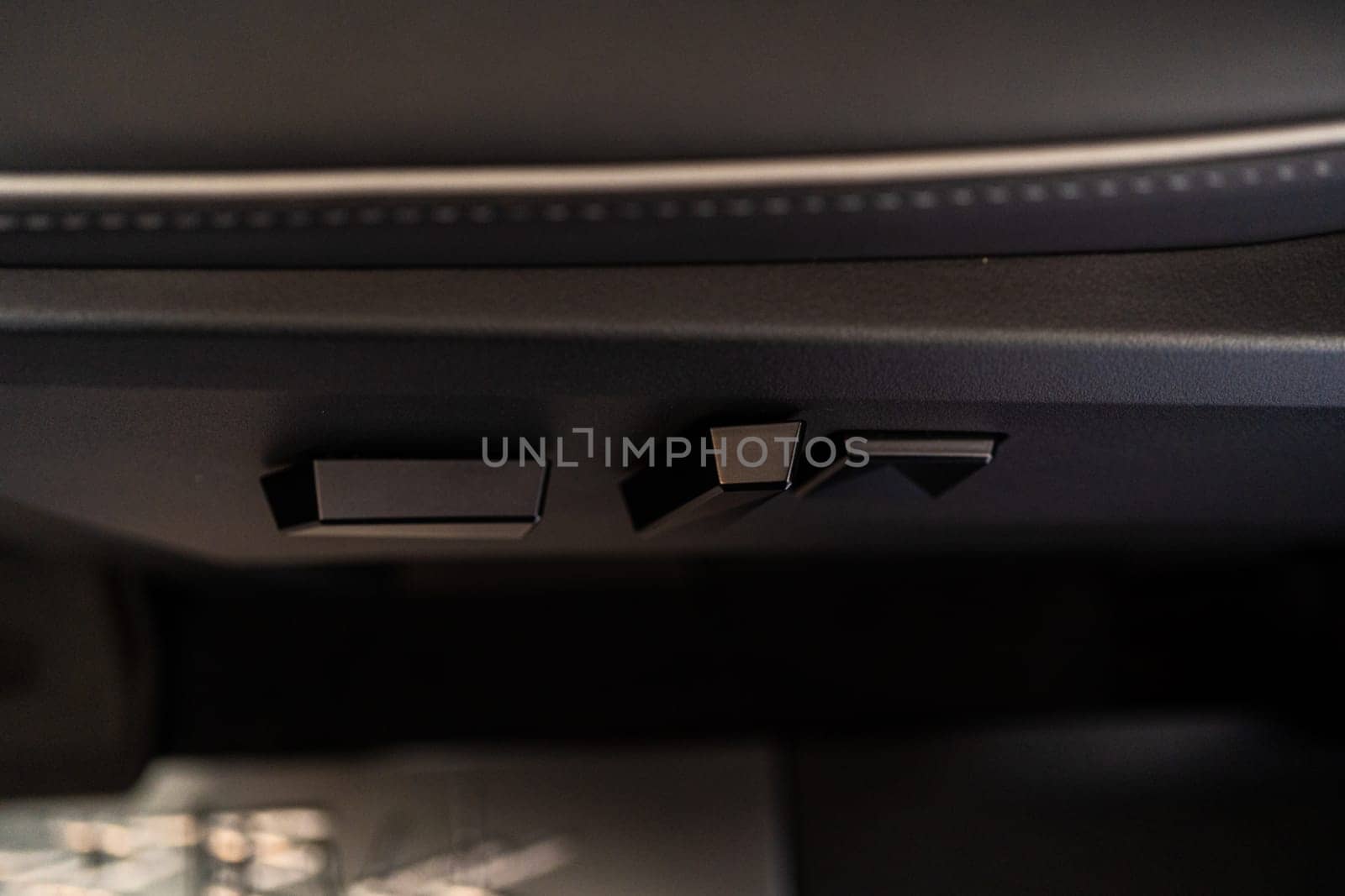Denver, Colorado, USA-May 5, 2024-This image captures a close-up view of the seat adjustment buttons located in the Tesla Cybertruck, emphasizing the minimalist and sleek design of the vehicle interior controls.