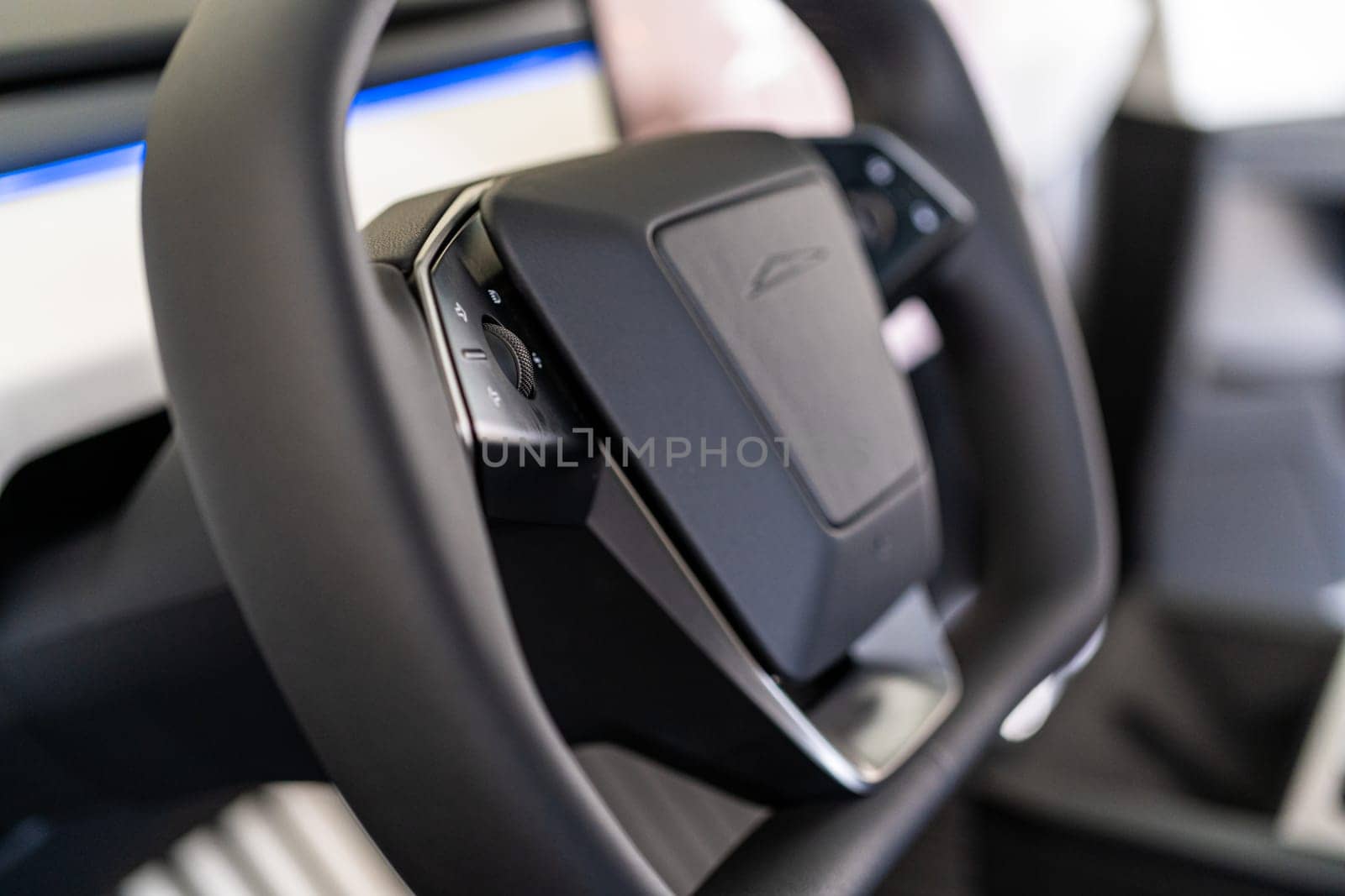 Close-Up View of the Steering Wheel in a Tesla Cybertruck by arinahabich
