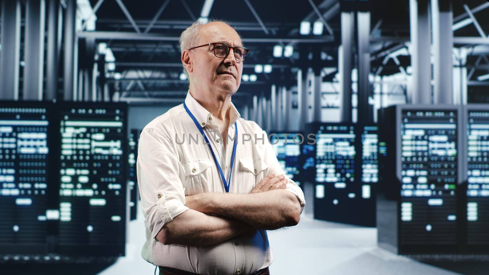 Portrait of elderly engineer looking around modern server room in data center, preparing to start comission on malfunctioning high tech facility hardware rigs in order to ensure errorless operations