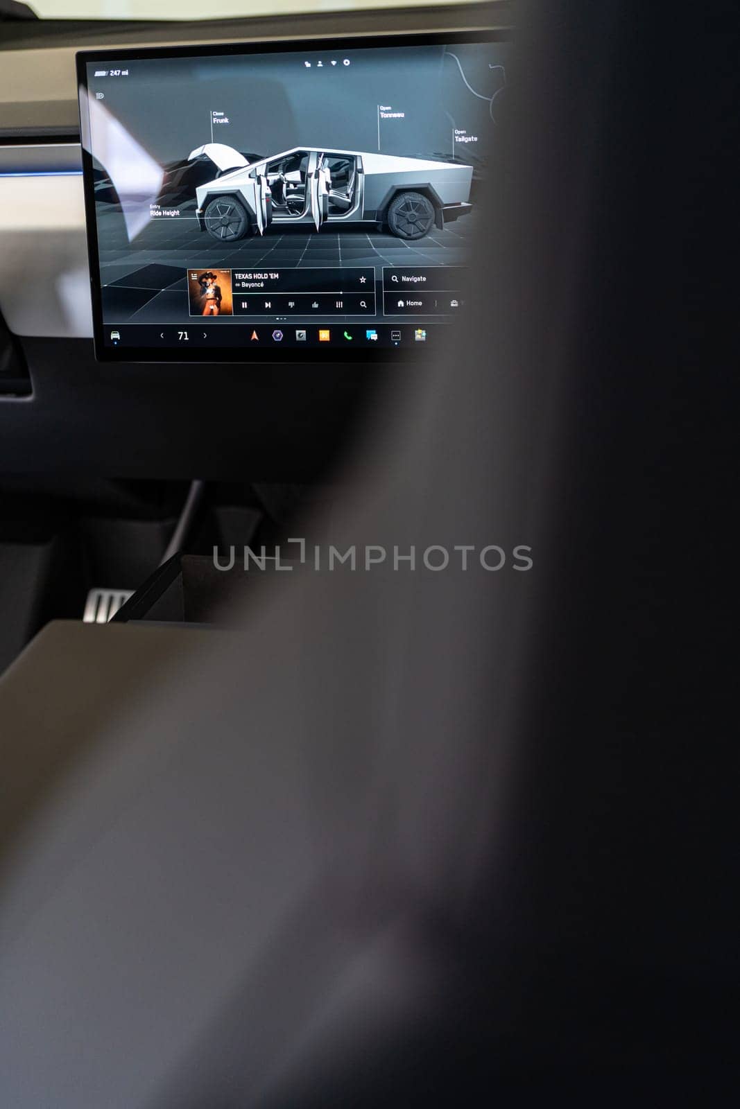 Interior view of a Tesla Cybertruck with touchscreen display by arinahabich