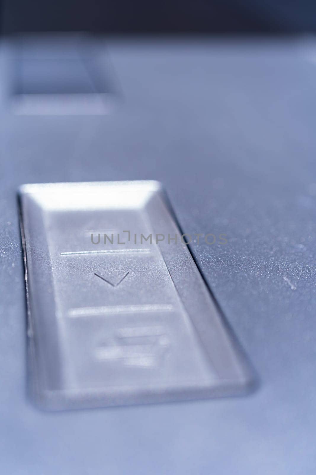 Denver, Colorado, USA-May 5, 2024-This image captures a close-up view of the control buttons used for operating the tailgate and tonneau cover of a Tesla Cybertruck, highlighting the futuristic and functional design elements.