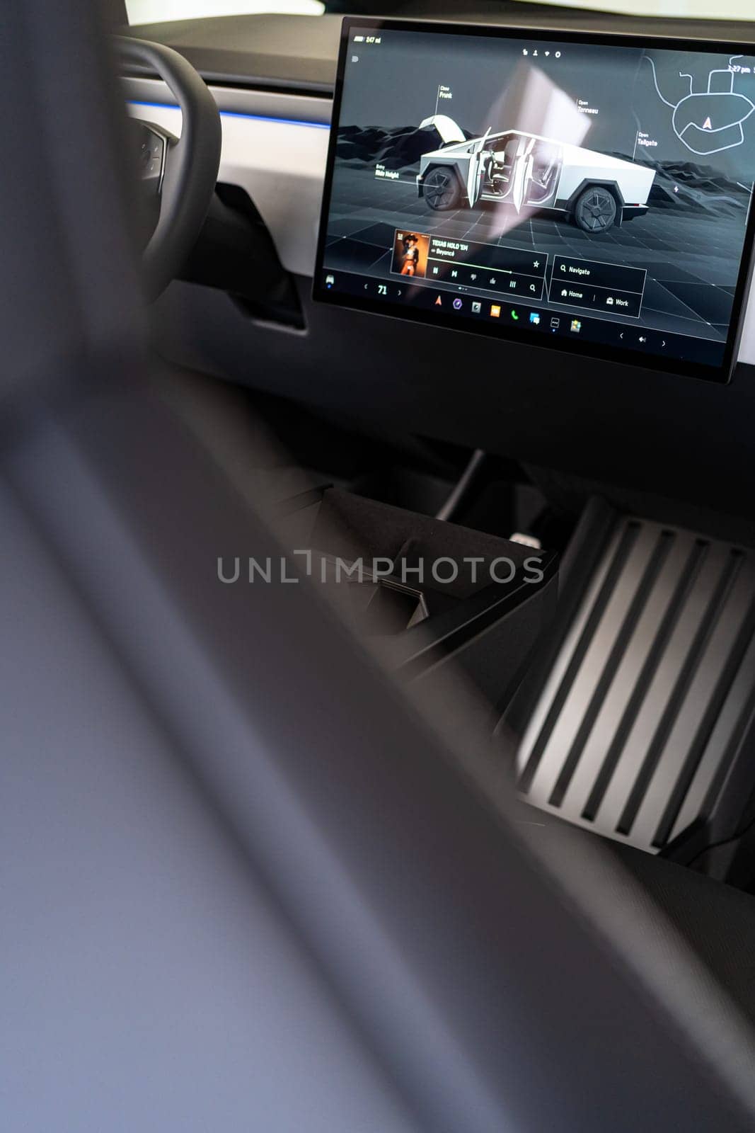 Interior view of a Tesla Cybertruck with touchscreen display by arinahabich