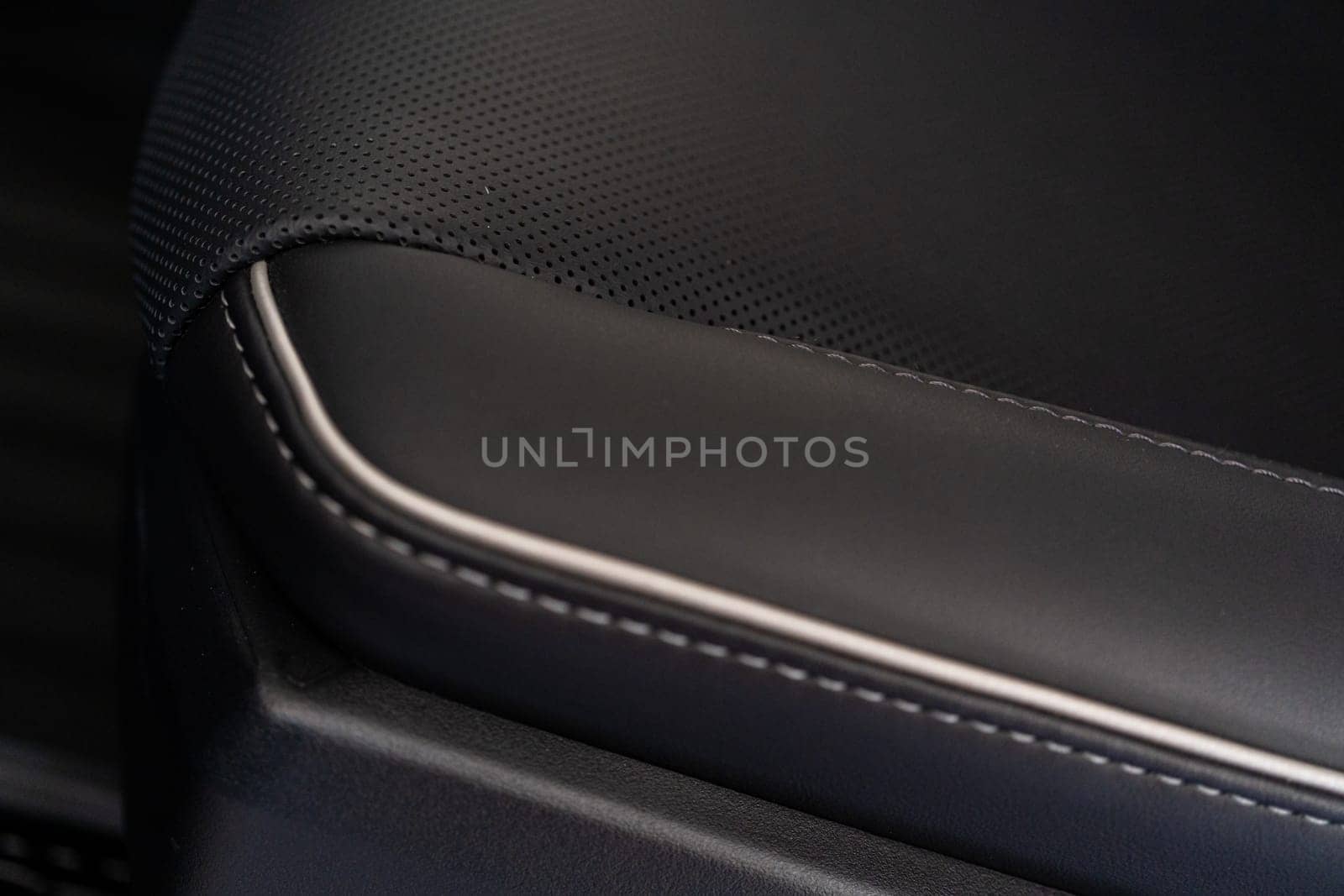Denver, Colorado, USA-May 5, 2024-This image captures a detailed close-up view of the intricate stitching on a leather seat inside a Tesla Cybertruck, showcasing the high-quality materials and craftsmanship.