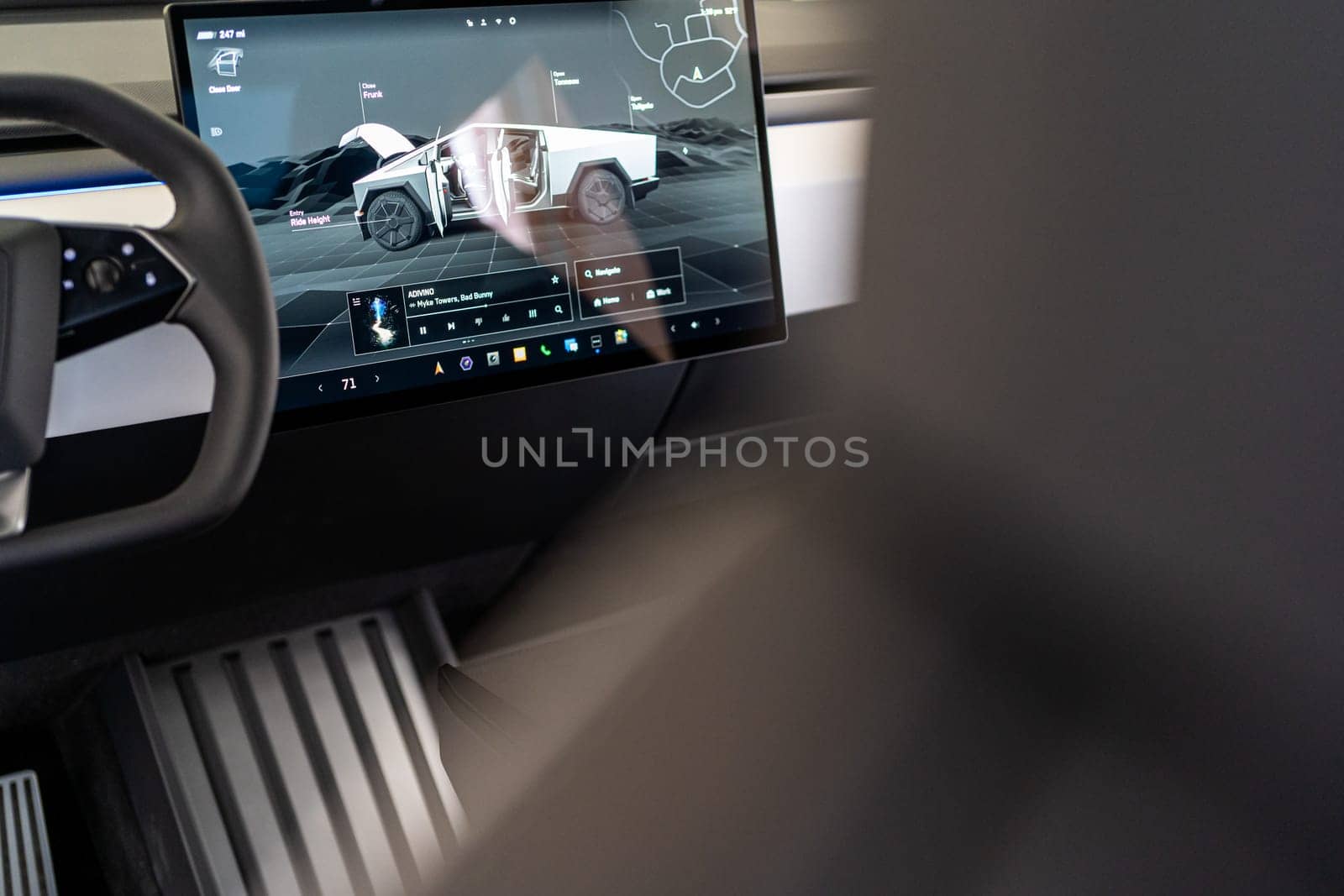 Denver, Colorado, USA-May 5, 2024-The interior of a Tesla Cybertruck showcasing its advanced touchscreen display, which is centrally located between the driver and passenger seats. This image highlights the modern design and technological features of the electric vehicle.