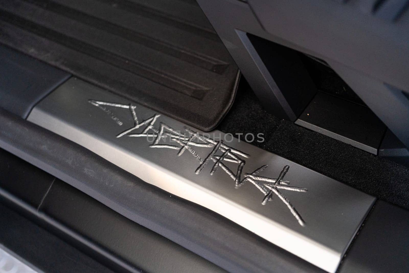 Denver, Colorado, USA-May 5, 2024-This image showcases the distinctive metal engraving of the Cybertruck logo on the interior of a Tesla Cybertruck, highlighting the vehicle unique branding elements and detailed craftsmanship.