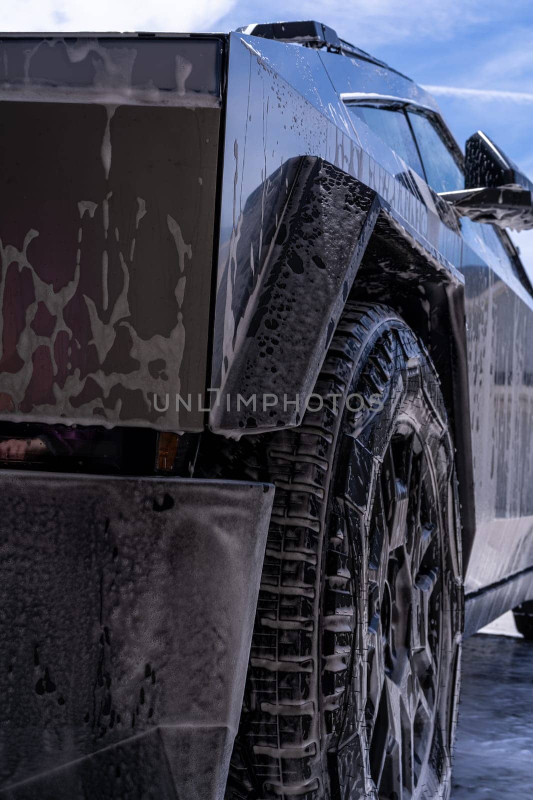 Washing a Tesla Cybertruck at a Car Wash by arinahabich