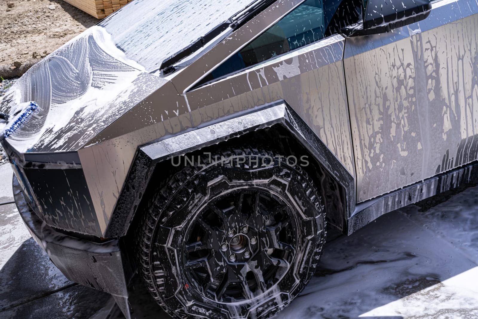 Washing a Tesla Cybertruck at a Car Wash by arinahabich
