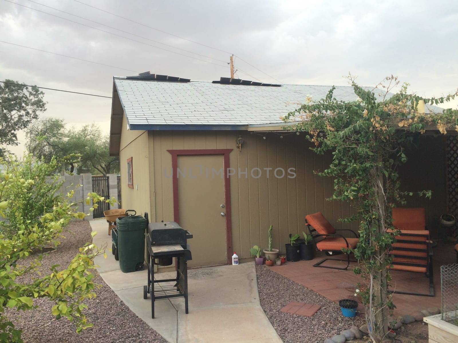Loose Shingles Blowing on my Roof in a Storm, Garage in Arizona by grumblytumbleweed