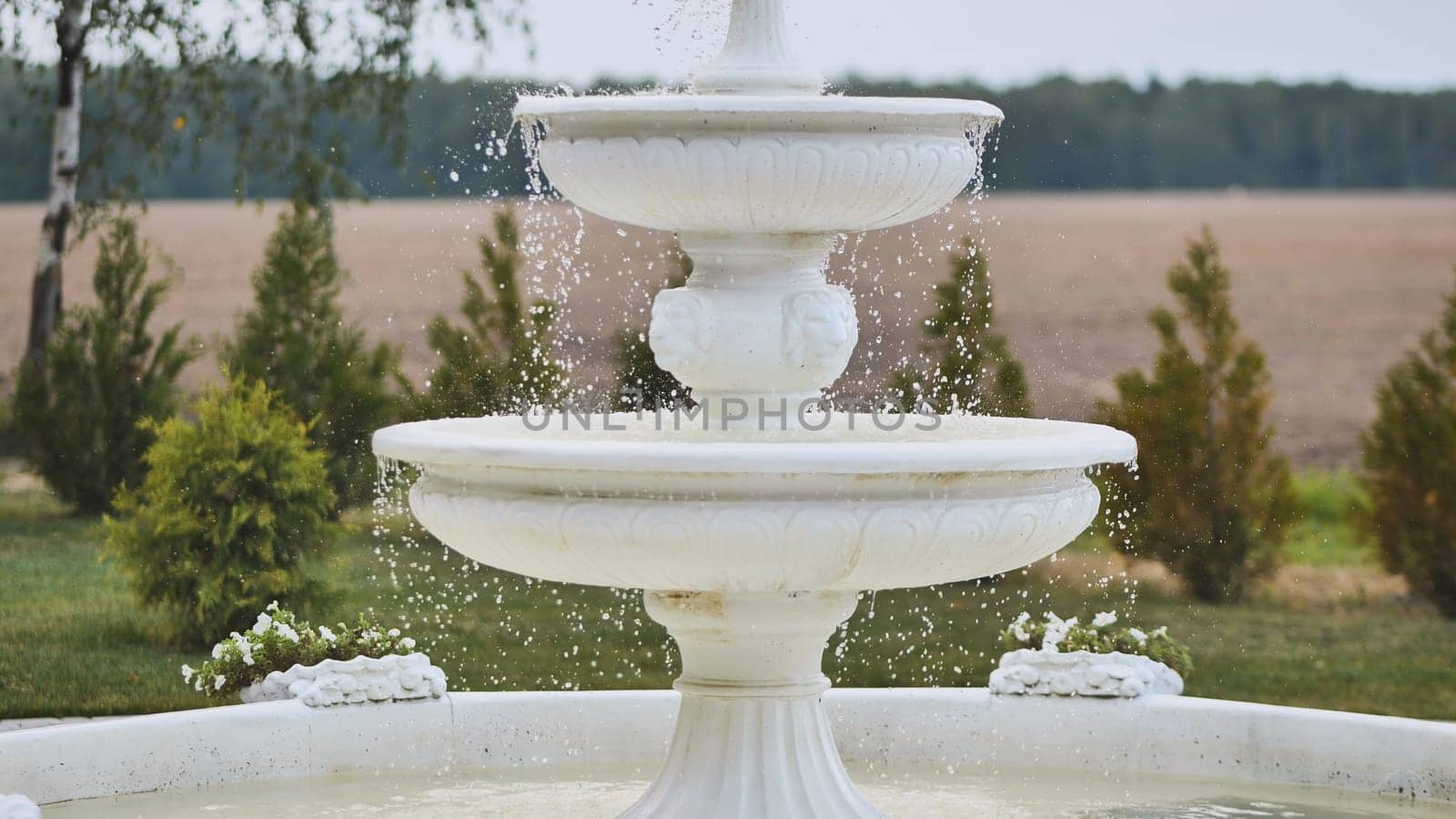 Vintage courtyard fountain isolated on white with clipping path