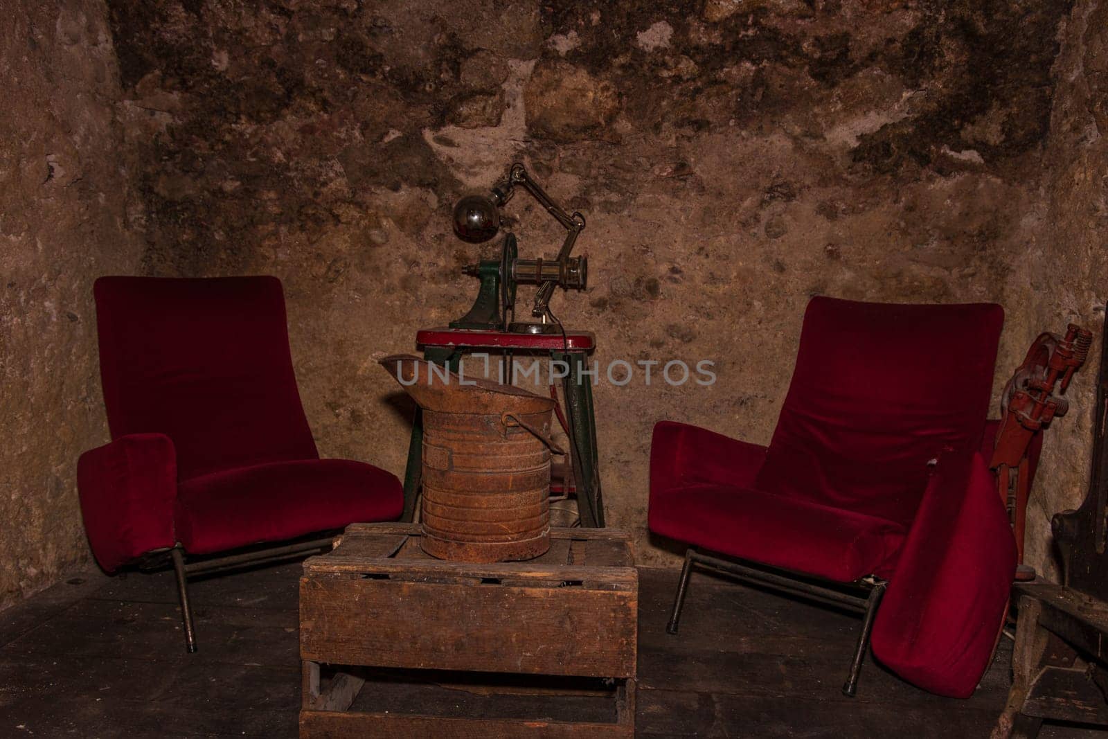 Old wine cellar with vintage wine bottles by vladispas