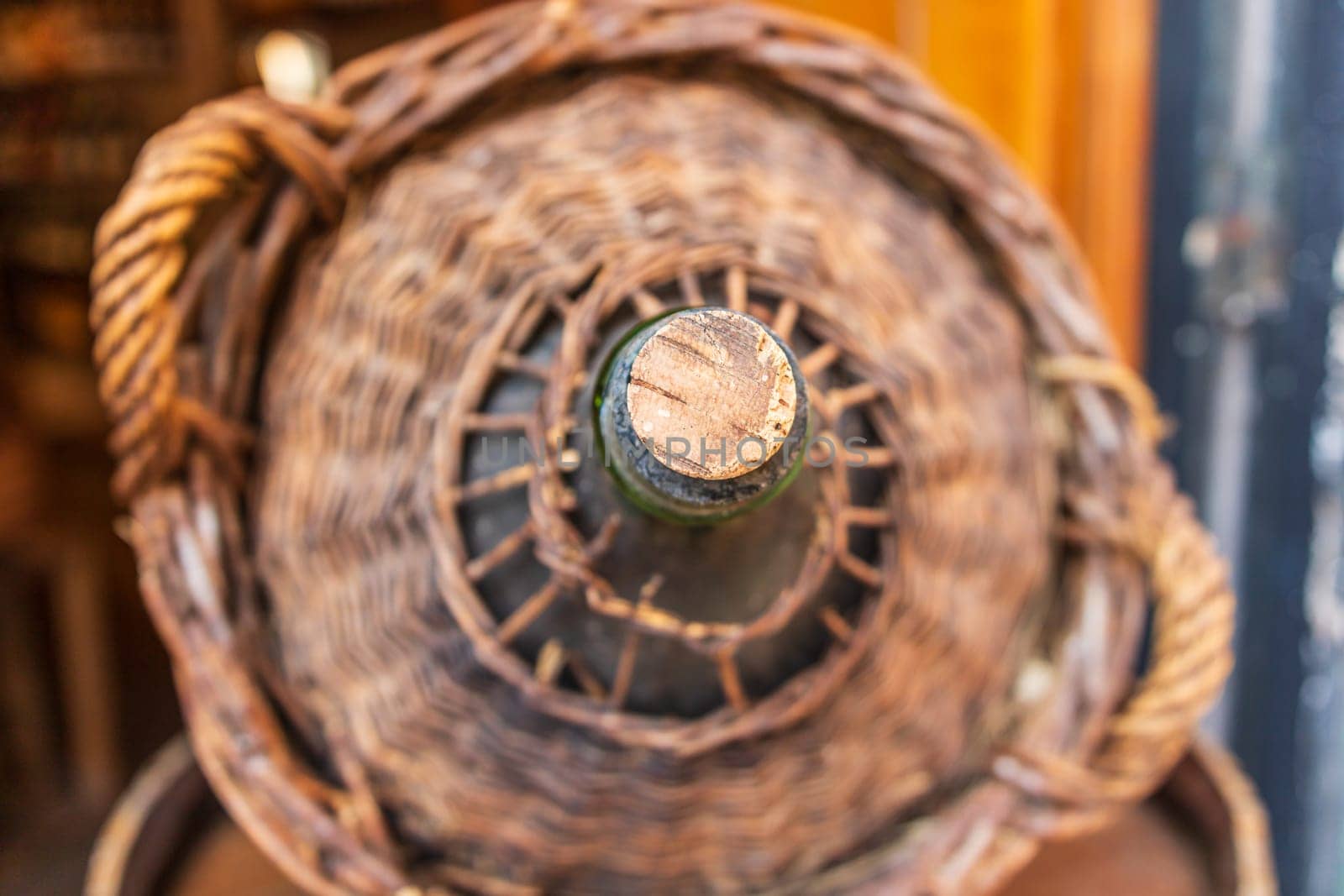 Close-up of aged wine demijohn by vladispas