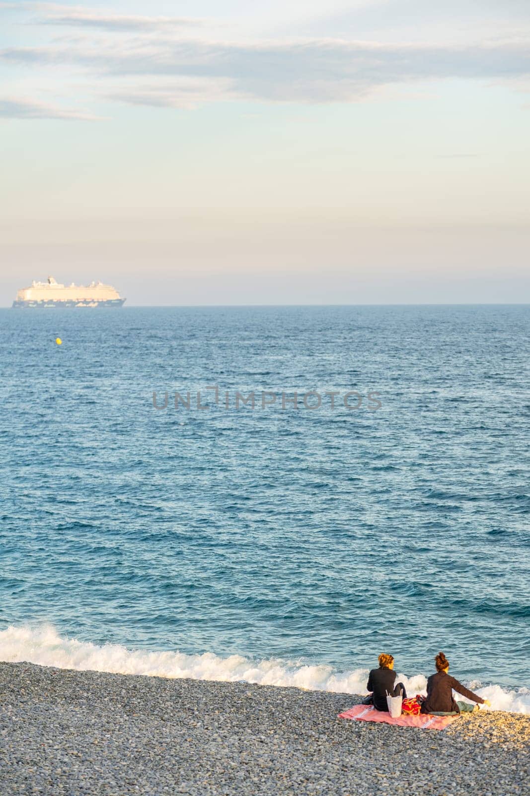 People at the beach in Nice, France, near the Promenade des Anglais