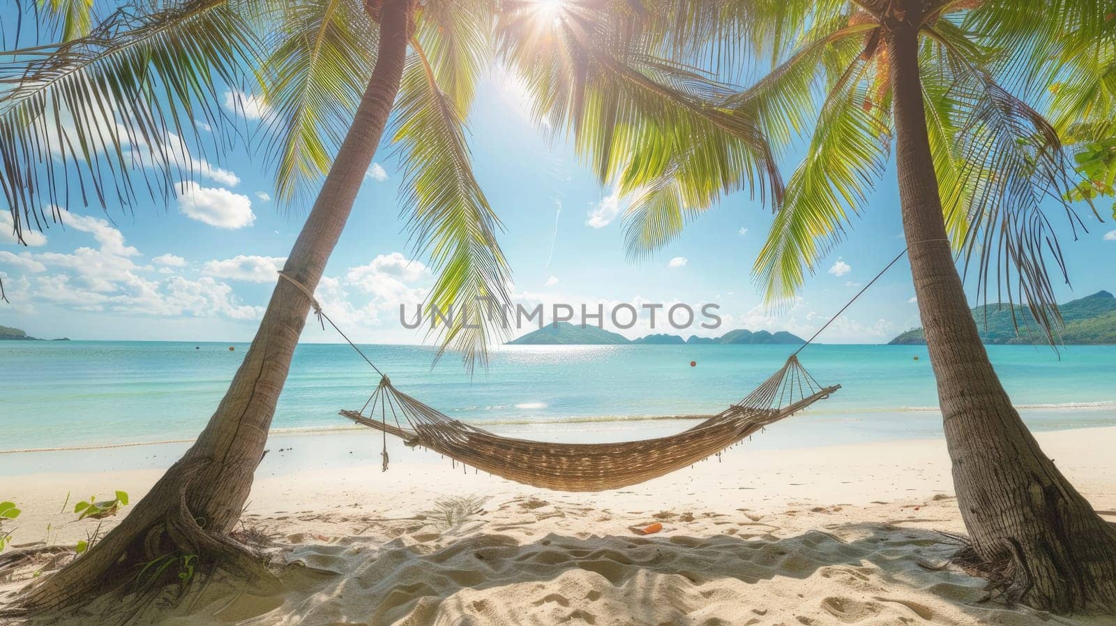 A hammock is swaying between two tall palm trees on a sandy beach, overlooking the crystalclear water and blue sky. The natural landscape is serene and perfect for relaxation AIG50