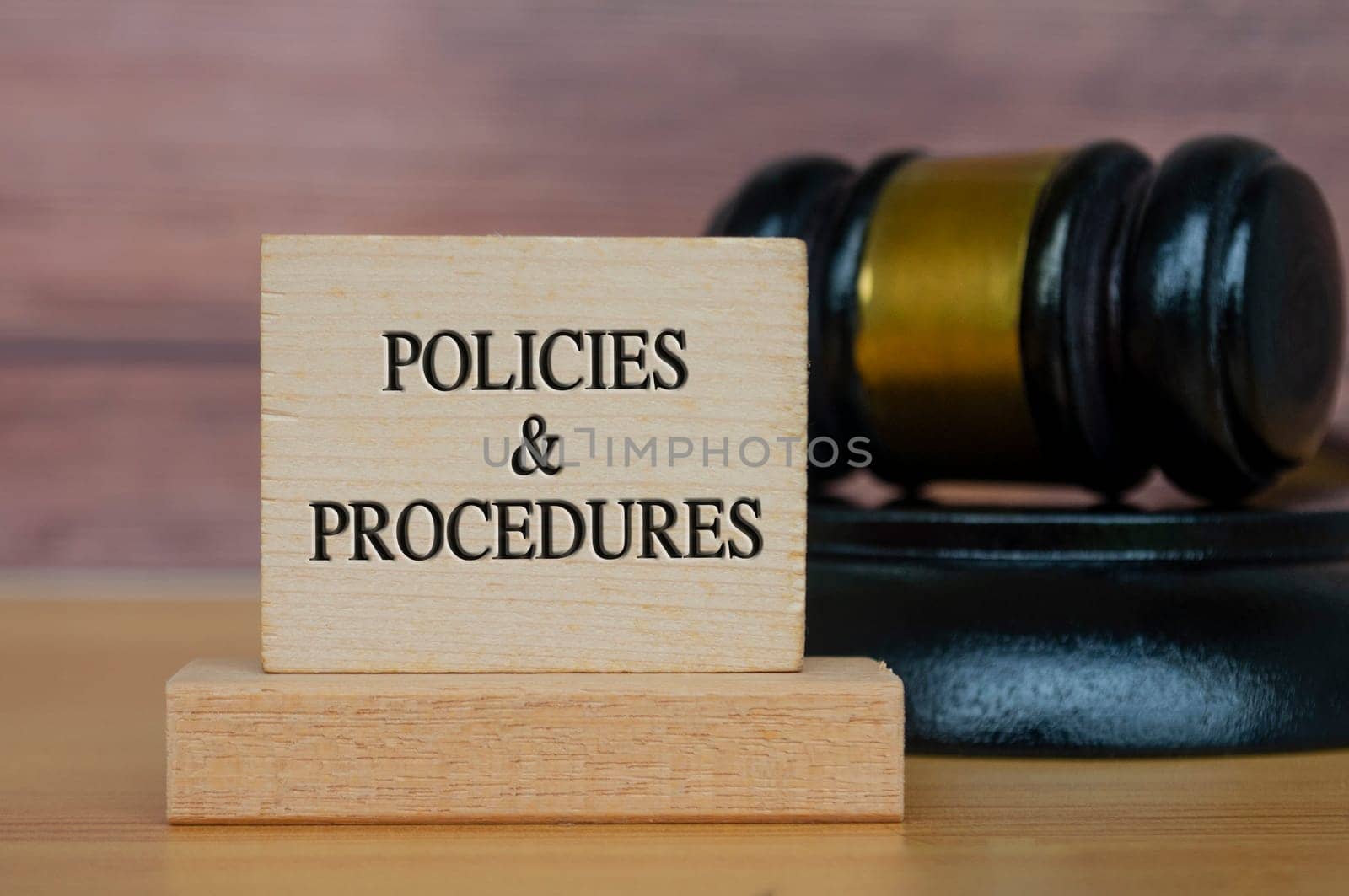 Policies and procedures text engraved on wooden block. Legal and law concept. by yom98