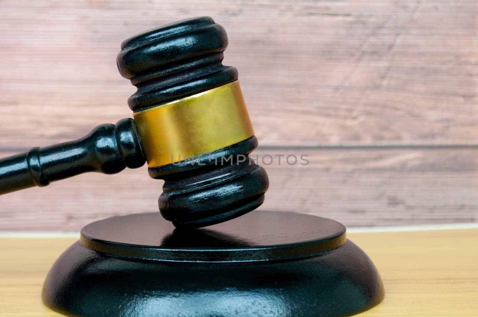Gavel on wooden background with customizable space for text or law matters. Law concept.
