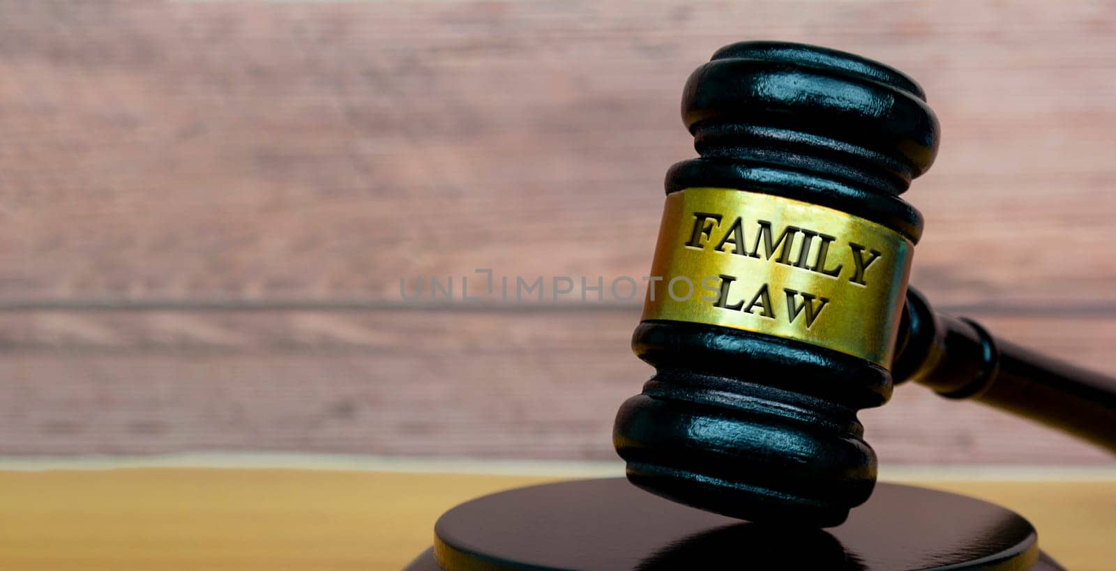 Family law text engraved on lawyer's gavel. Legal and law concept