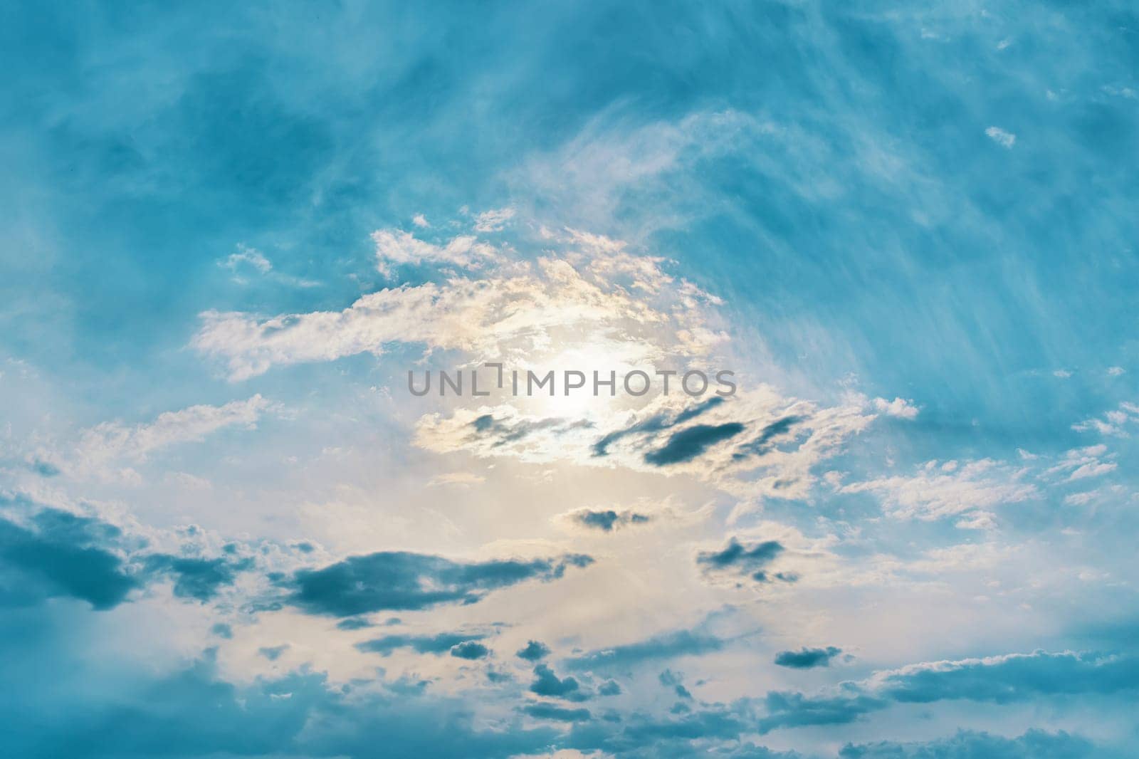 Sun in the sky. Sun in the sky. Sunny background, blue sky with white clouds and sun.