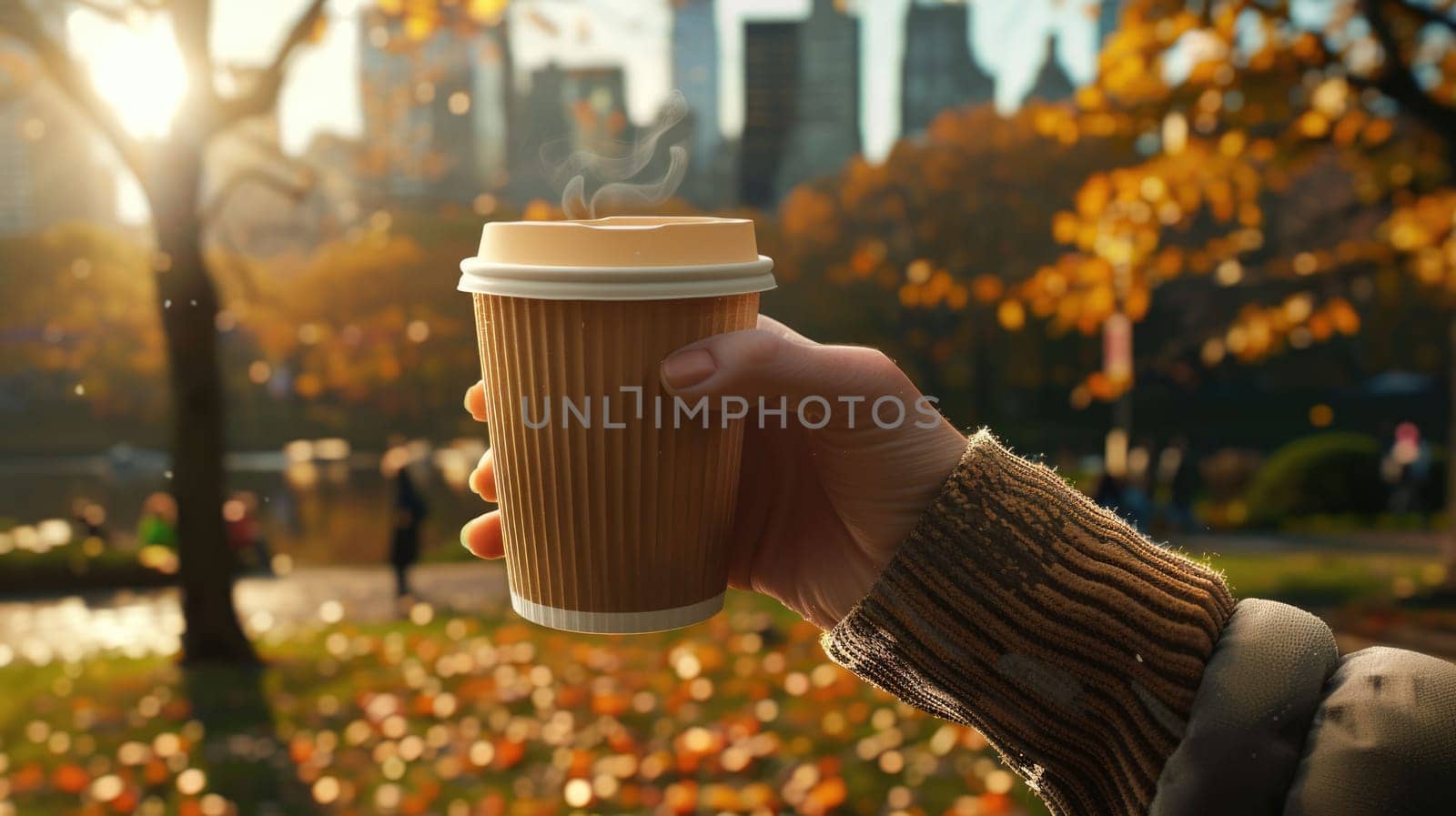 The close up picture of the person is holding the cup of the coffee by their own hand to relax inside the park for the relaxation also has been filled with trees and plants in the bright day. AIG43.