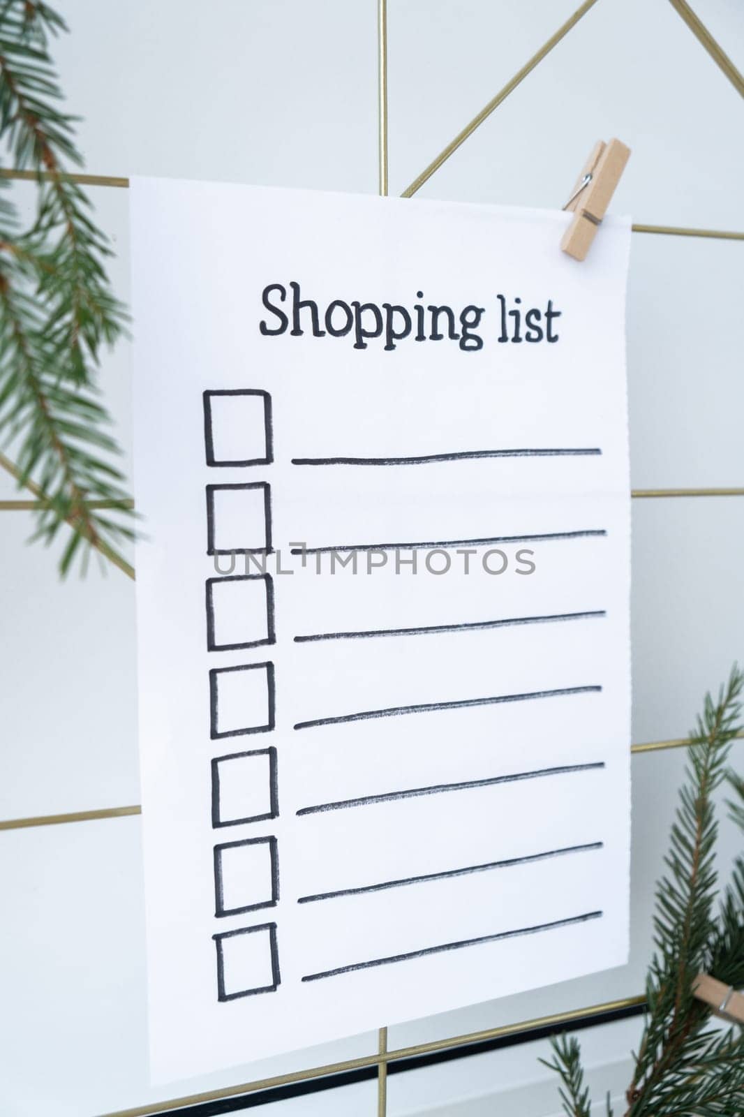 Preparation for winter holidays. SHOPPING LIST text on paper note. Celebration gifts and presents preparing Natural zero waste homemade Christmas decor. Happy new year by anna_stasiia