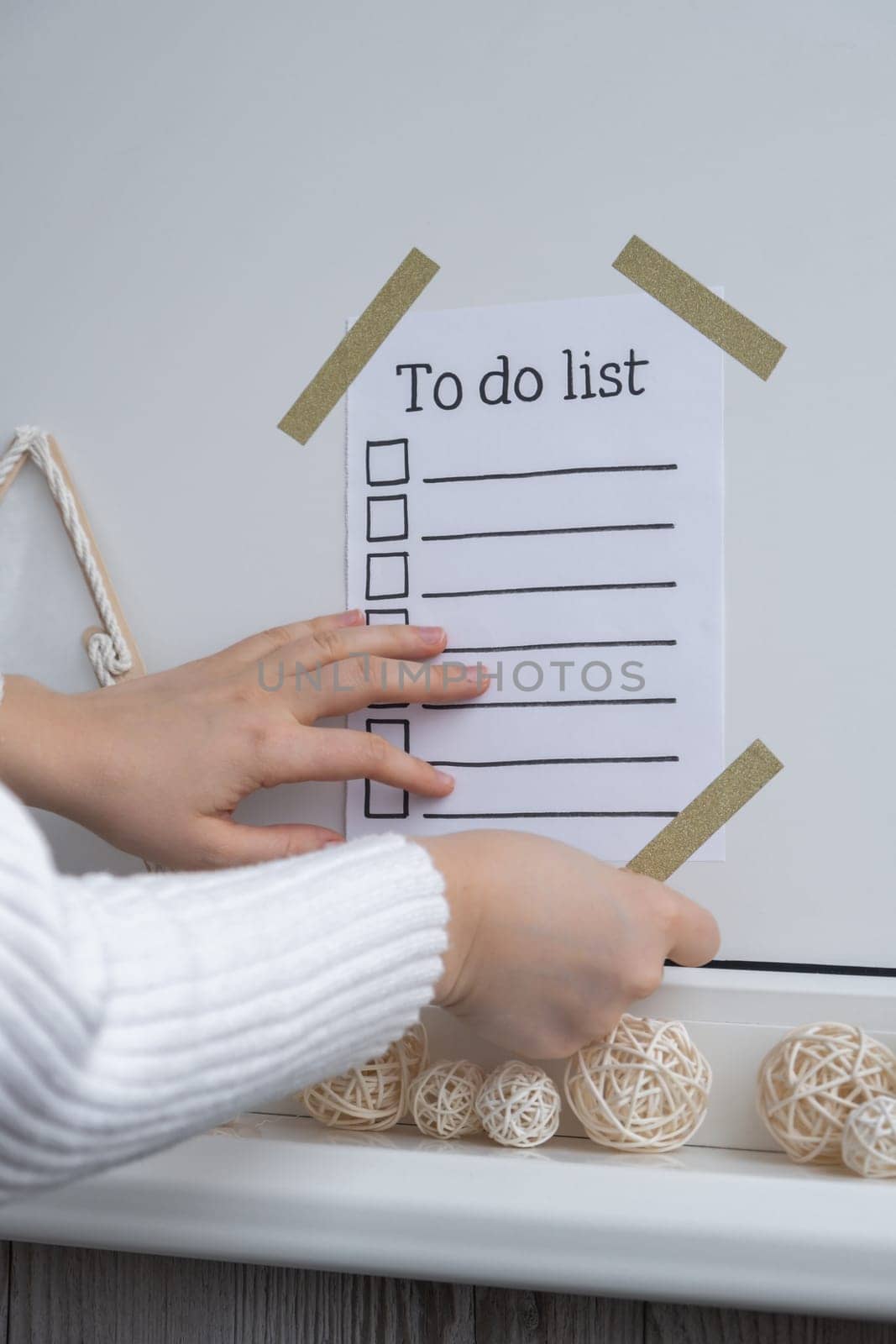Unrecognizable woman creating vision board with Motivational paper note TO DO LIST. Goals setting concept. Strategy for self development improvement. Inspirational Planning better healthier life. Visual motivation