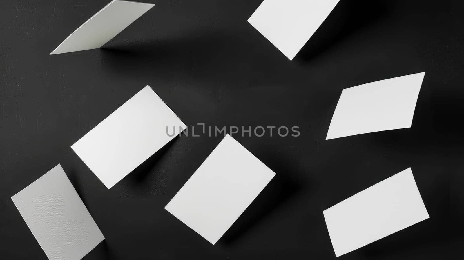 A collection of white cards with a black background.