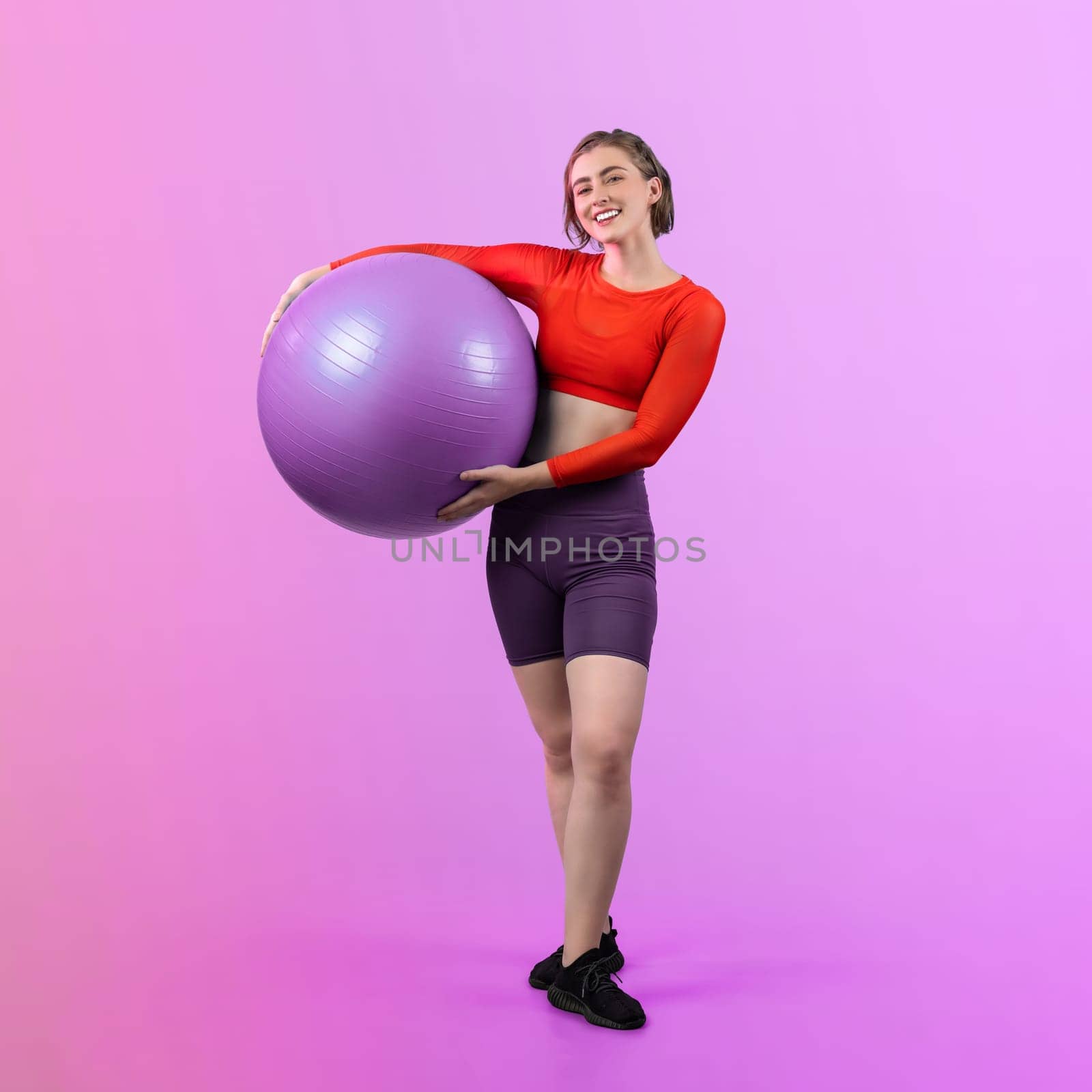 Full body length gaiety shot athletic and sporty young woman with fitness ball by biancoblue