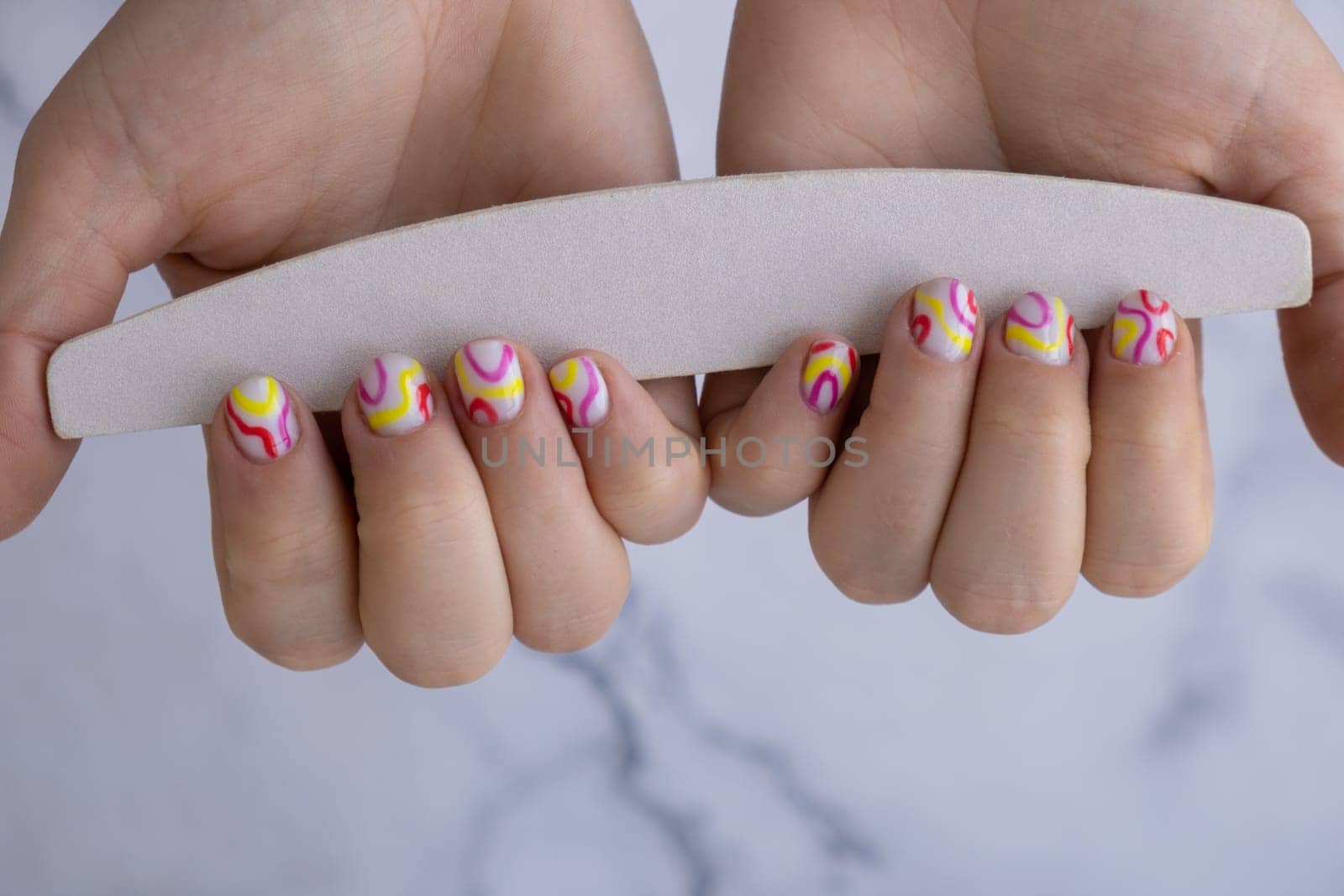 Manicure tools Woman manicured hands, stylish summer colorful nails. Closeup of manicured nails of female hand. Summer style of nail design concept. Beauty by anna_stasiia