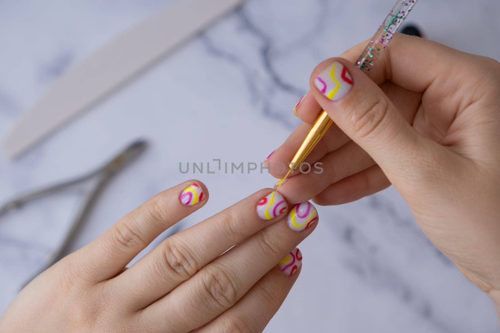 Manicured tools Stylish colorful summer female nails. Modern trendy stylish Beautiful manicure. Cute pastel nail minimalistic design concept of beauty treatment. Gel nails. Skin care by anna_stasiia